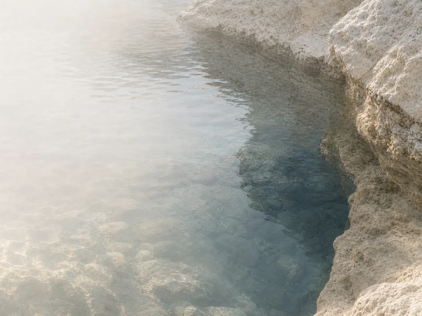 Clear water at a deep stone edge