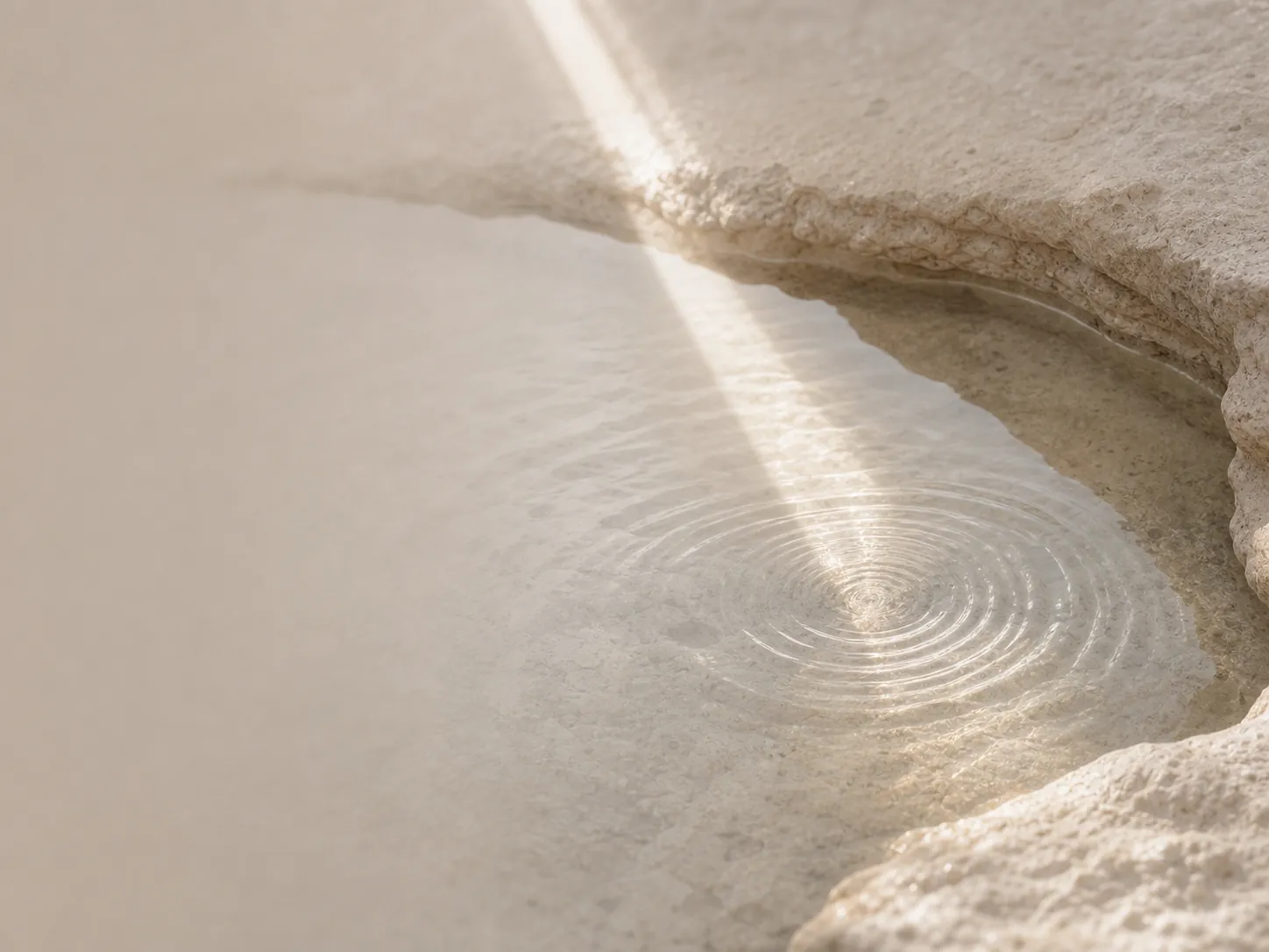 Circles of light on clear water